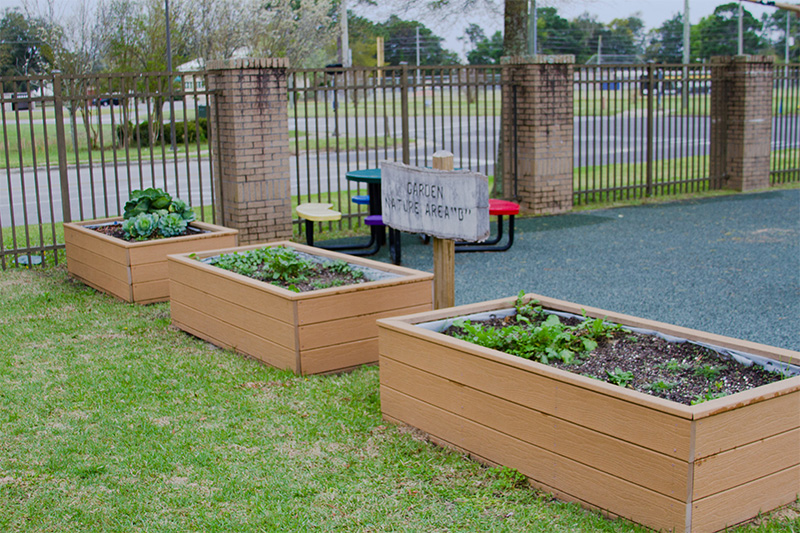 An outdoor space with a sign reading 