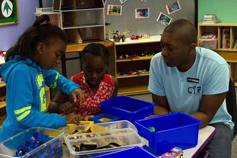 Children play with building block toys